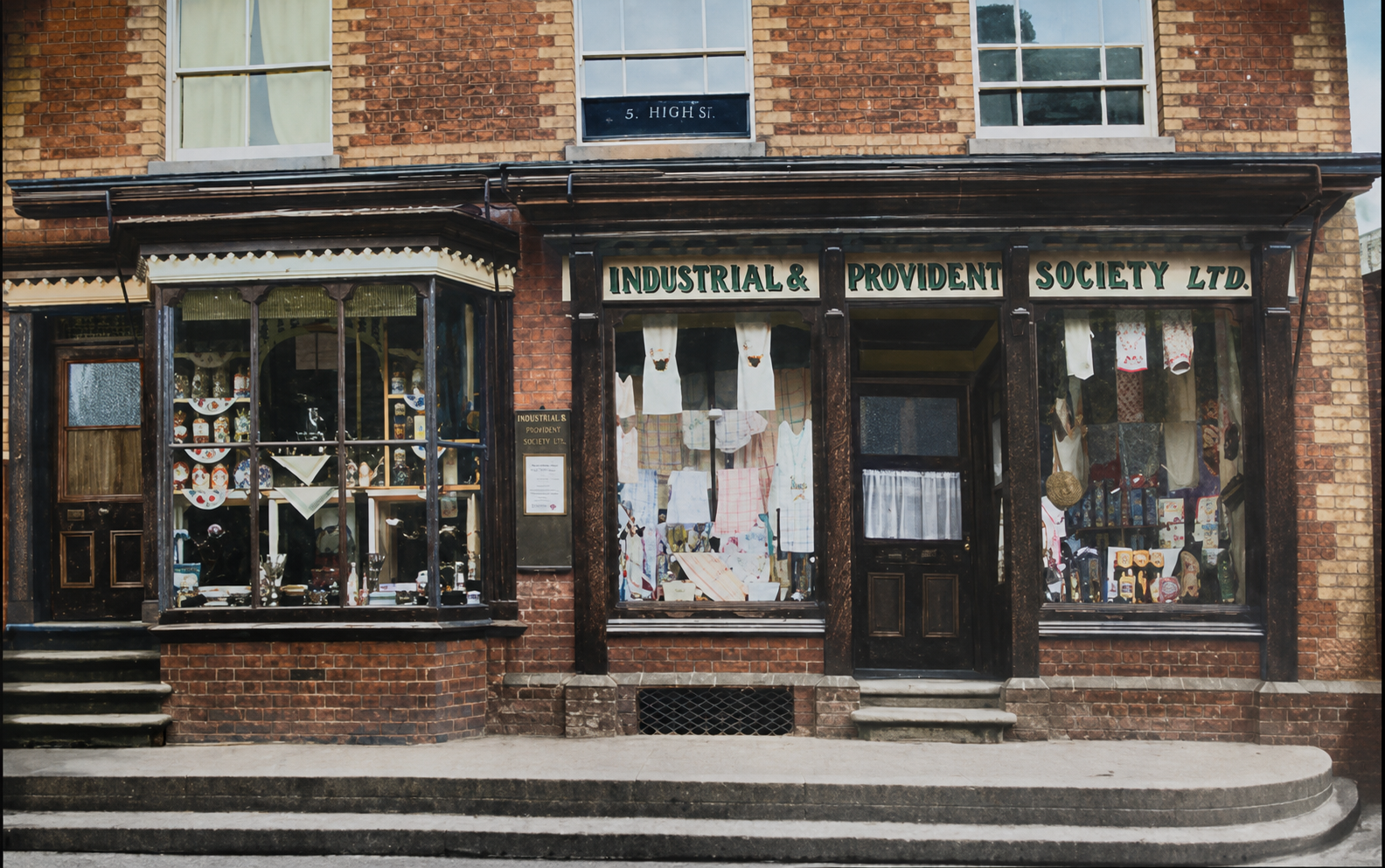 Co-op Central Stores, 5 High Street, corner of Thrift Street — the full Industrial & Provident Society Ltd fascia with bay window and drapery display